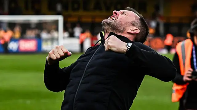 Charlton manager Nathan Jones screams skywards in celebration