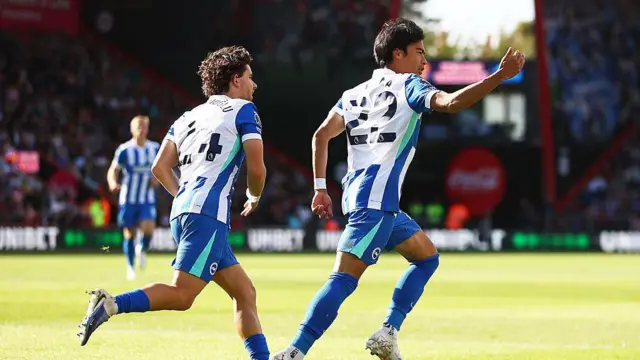 Kaoru Mitoma celebrates scoring 
