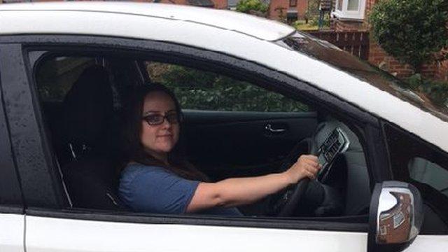 Rachael Crooks behind the wheel of her electric car