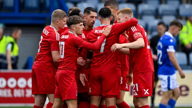 The Aberdeen players celebrate Ester Sokler's (centre) goal making it 1-0 during a Premier Sports Cup group stage match between Queen of the South and Aberdeen