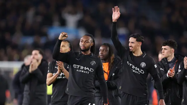 Manchester City Players wave to fans