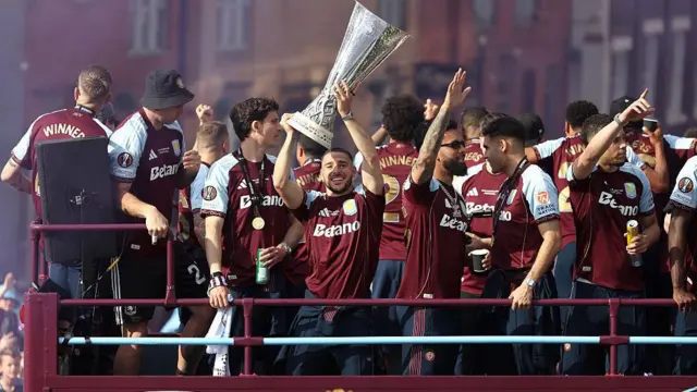 Emi Buendia holds the Europa League trophy