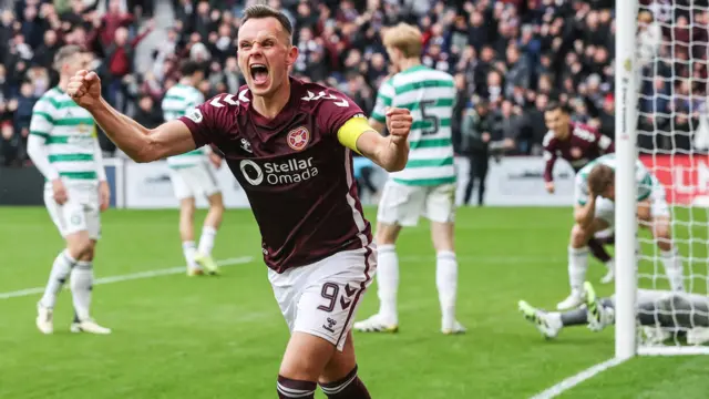 Lawrence Shankland celebrates after scoring a penalty for Hearts against Celtic