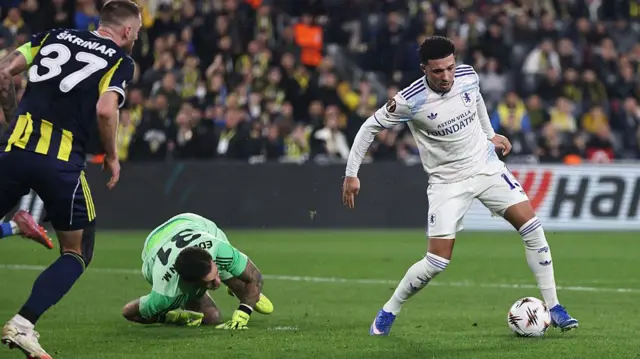 Jadon Sancho rounds goalkeeper Ederson