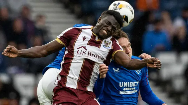 St Johnstone's Adama Sidibeh and Rangers' Kieran Dowell