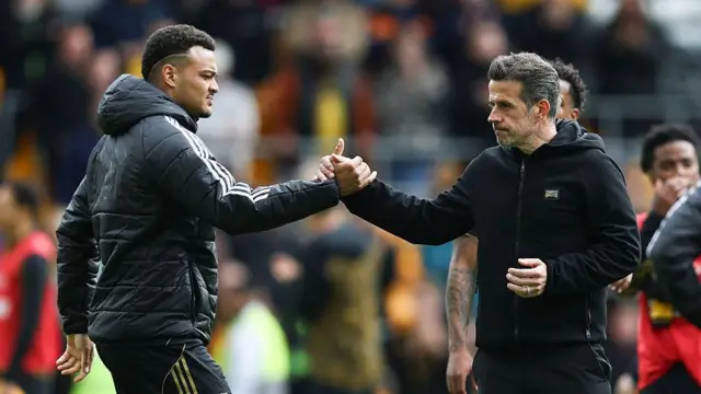 Rodrigo Muniz and Marco Silva clasping hands