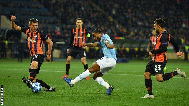 Raheem Sterling has a shot against Shakhtar Donetsk in the Champions League