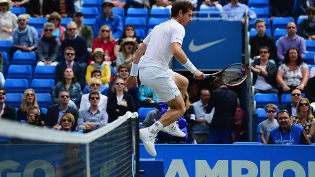 Andy Murray jumps over a box