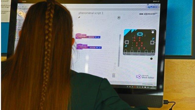 Girl programming a Micro Bit