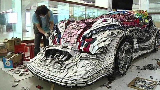 Artist working on mobile phone car