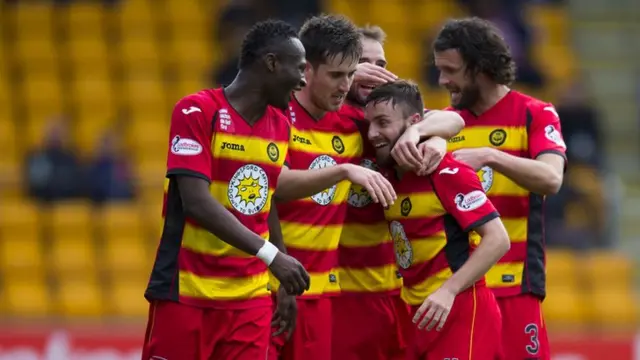 Goalscorer Steven Lawless is congratulated by his Partick Thistle team-mates