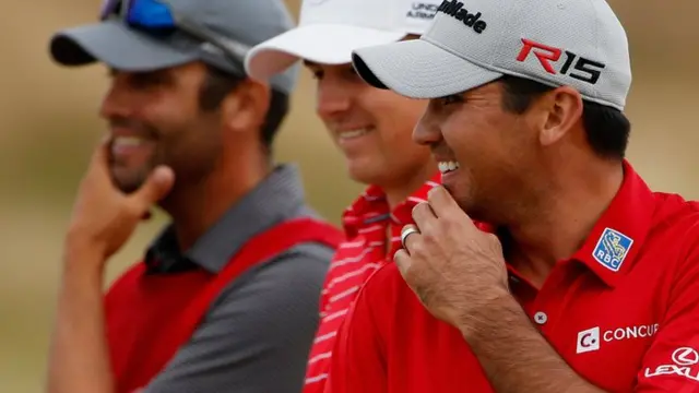 Spieth, Day and Greller look on