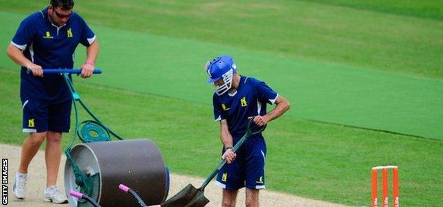 Groundsman prepare a pitch at Edgbaston