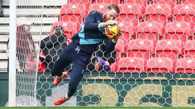 Stoke City keeper Viktor Johansson warming up before their game against Plymouth Argyle in January