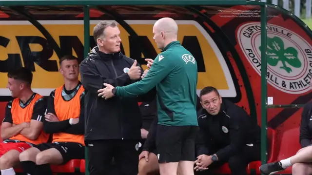 Magilton in discussion with the match officials