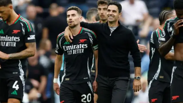 Arsenal's Jorginho and Mikel Arteta celebrate after winning the Premier League match against Tottenham Hotspur at the Tottenham Hotspur Stadium.