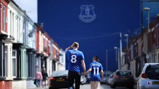 Everton fans walk to Goodison Park