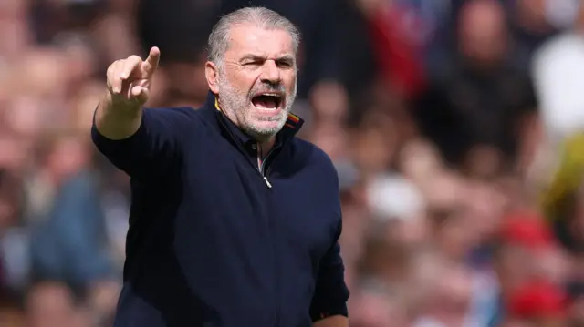Ange Postecoglou pointing his finger and shouting instructions to his Nottingham Forest players from the touchline