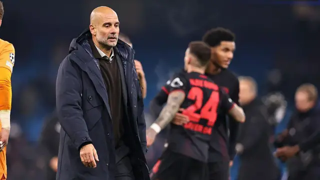 Pep Guardiola looks dejected after defeat to Bayer Leverkusen