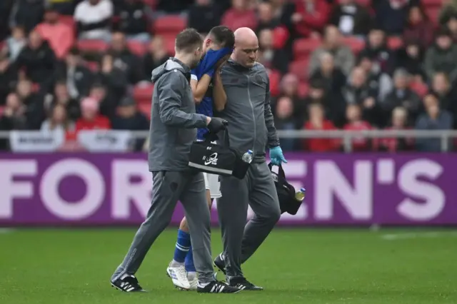 Cardiff City centre-back Dimitrios Goutas looks dejected after sustaining an injury