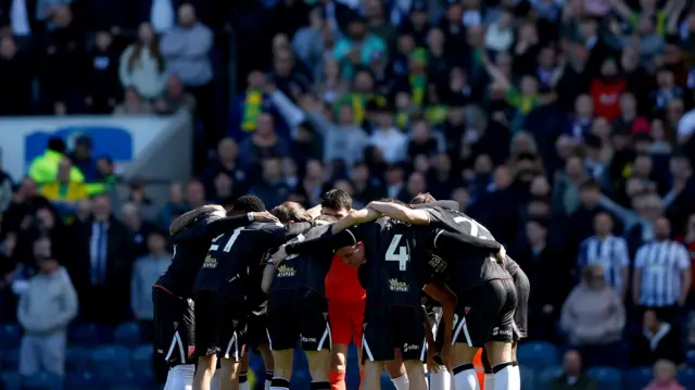 A photo of West Bromwich Albion's team huddle during their match against Blackburn Rovers