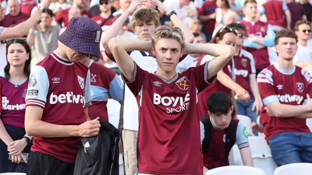 West Ham fan looks dejected