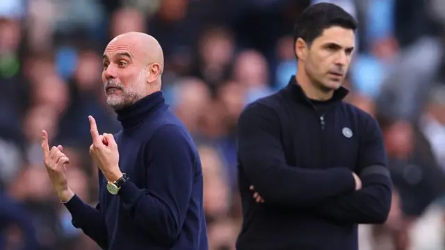 Pep Guardiola and Mikel Arteta on the touchline facing away from each other