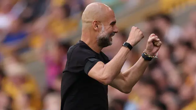 Pep Guardiola the head coach / manager of Manchester City celebrates during the Premier League match between Wolverhampton Wanderers and Manchester City at Molineux
