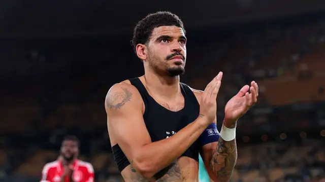 Morgan Gibbs-White applauds fans after match