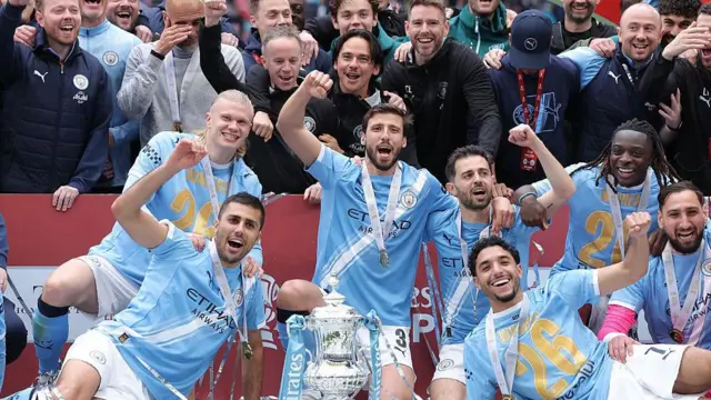 Manchester City celebrate with FA Cup