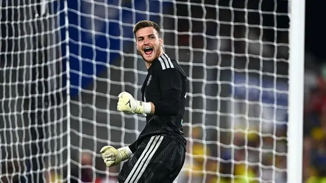 Manchester United goalkeeper Dermot Mee celebrates his matchwinning penalty save against Leeds at Croke Park
