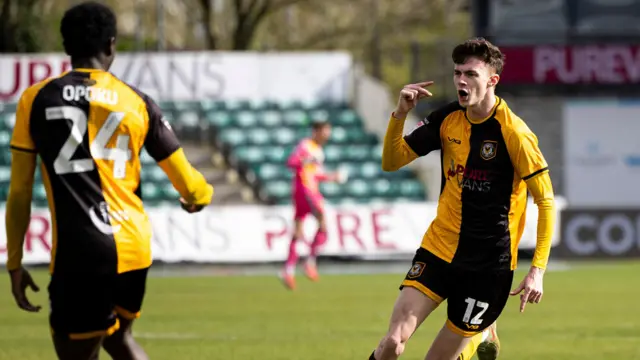 Joe Thomas celebrates after scoring against Harrogate