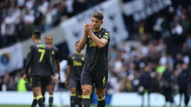 James Tarkowski of Everton applauds the fans at the end of the Premier League match between Tottenham Hotspur FC and Everton FC at Tottenham Hotspur Stadium