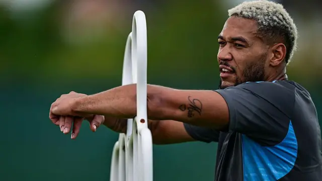 Joelinton of Newcastle United stands during training