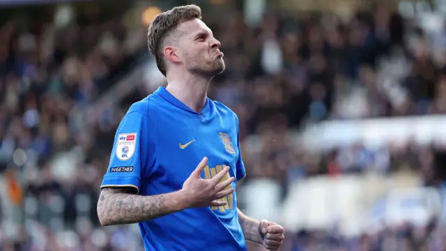 A close-up of Marvin Ducksch scrunching his face as he celebrates his goal wearing a blue Birmingham City home kit