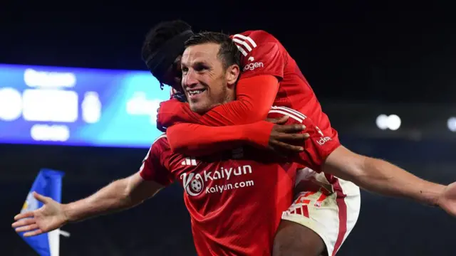 Chris Wood of Nottingham Forest celebrates with Anthony Elanga of Nottingham Forest after scoring a goal to make it 1-3 during the Premier League match between Leicester City and Nottingham Forest at the King Power Stadium 