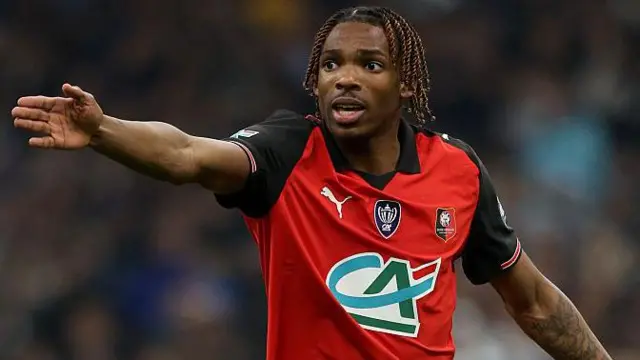 Jeremy Jacquet gestures with his arm during a Rennes game