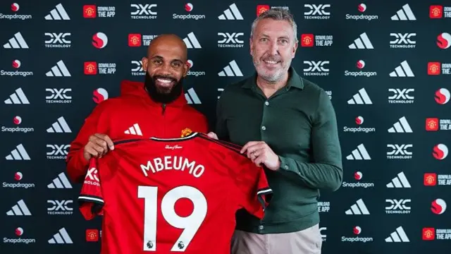 Manchester United technical director Jason Wilcox (right) welcomes new signing Bryan Mbeumo to the club in July
