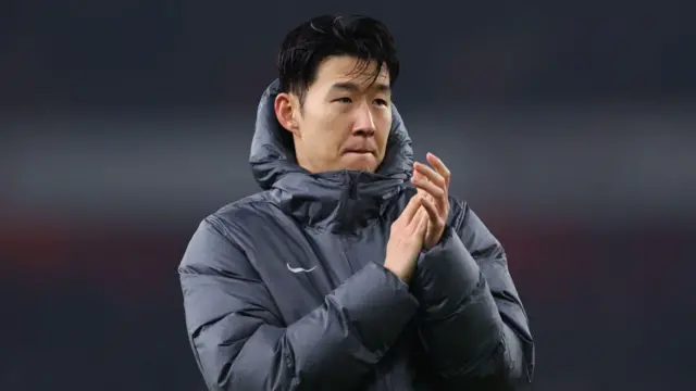 Son Heung-min applauds fans after match