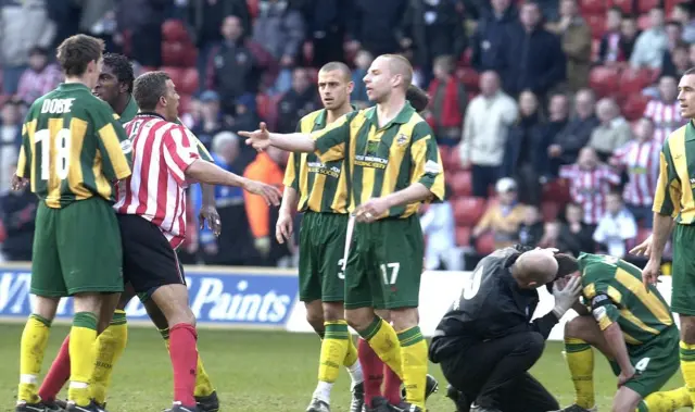 Derek McInnes (right) receives treatment in 2002