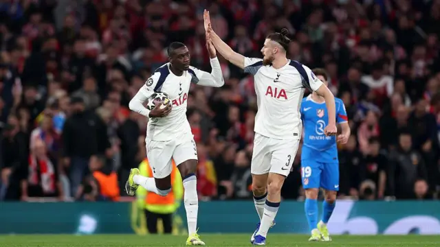Randal Kolo Muani celebrates scoring his goal with team-mate Radu Dragusin