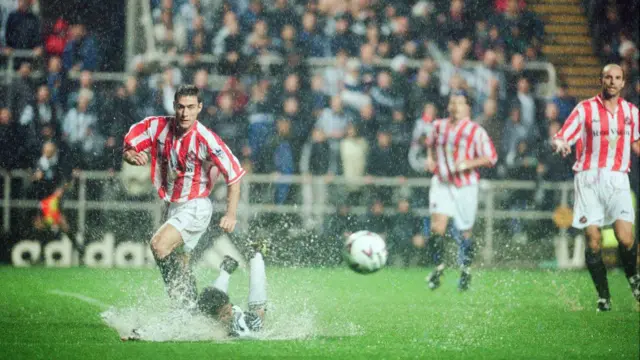Players struggle on a waterlogged pitch during Newcastle 1-2 Sunderland in the Premier league at St James' Park in August 1999