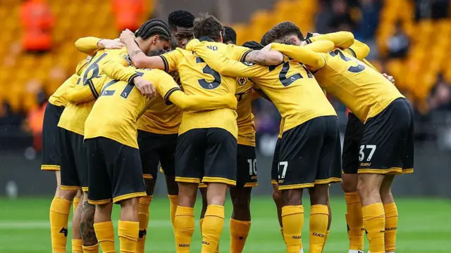 Wolves players huddle ahead of kick-off in the Premier League