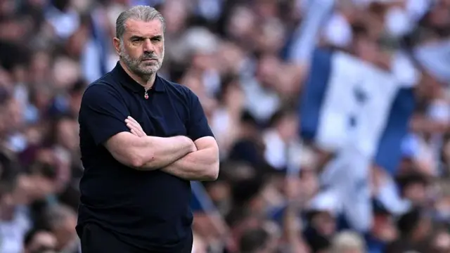 Tottenham manager Ange Postecoglou stands in his technical area