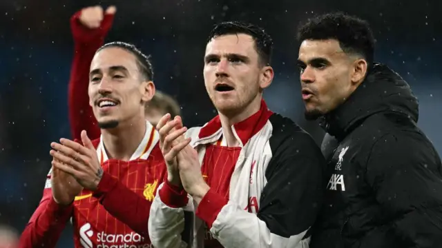 Kostas Tsimikas, Andrew Robertson and Luis Diaz celebrate