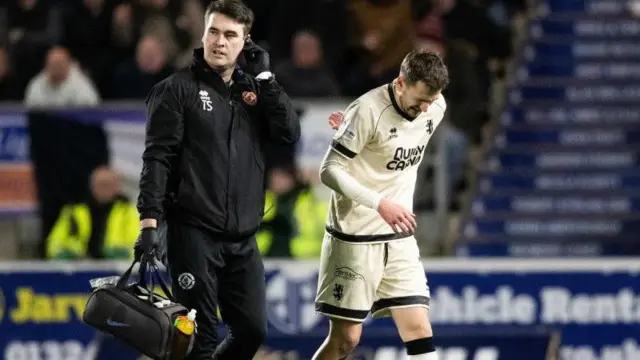 Dundee United's Kristijan Trapanovski (right) leaves the field against Falkirk