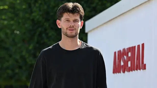 Illan Meslier arriving at Arsenal's training ground
