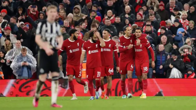 Cody Gakpo celebrates with Virgil van Dijk, Trent Alexander-Arnold, Mohamed Salah and Joe Gomez after scoring for Liverpool against Newcastle in a Premier League game at Anfield