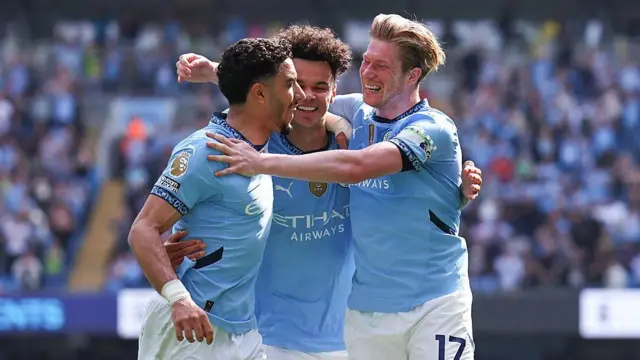 Omar Marmoush, Nico O'Reilly and Kevin De Bruyne celebrate a goal for Manchester City