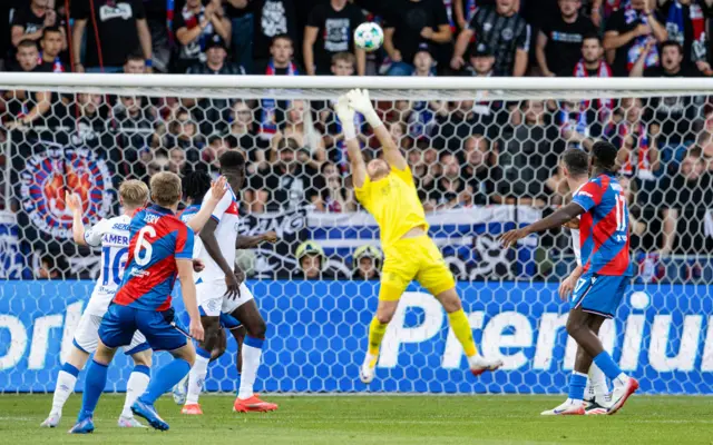 Viktoria Plzen's Lukas Cerv (L) takes a shot but it's pushed over the crossbar by Rangers' Jack Butland during a UEFA Champions League Third Round Qualifier, Second Leg